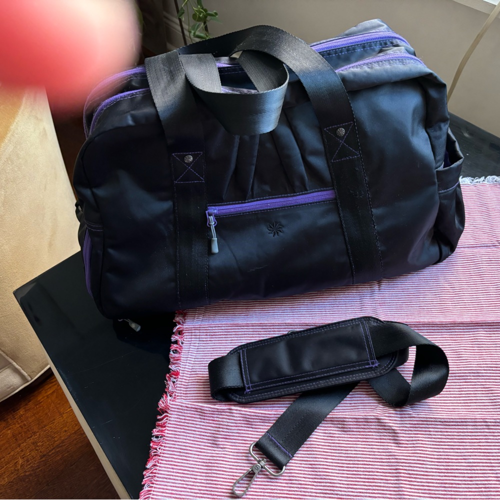 Athleta Gym/Duffle Bag, Black with stylish purple zip lines.